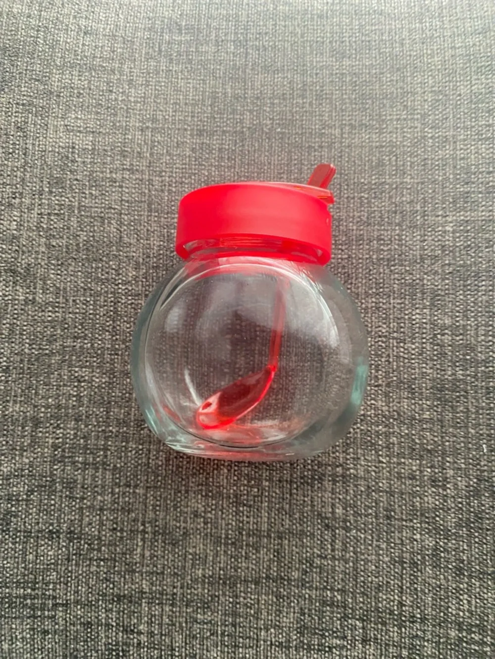 Clear Glass Honey Jar with Red Lid and Spoon